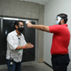 A paramedic measures the temperature of a press staffer at a Liga MX match Friday in Mazatlan, Mexico.